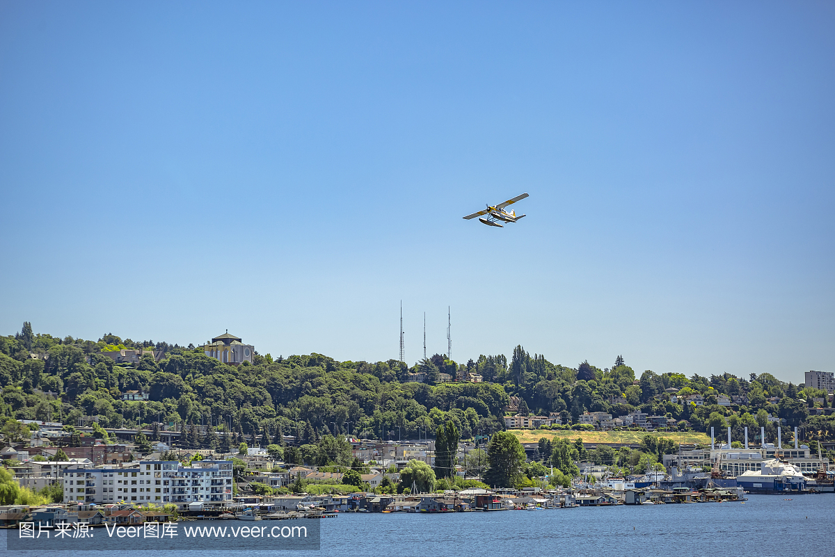 Float plane taking off in Seattle over trees