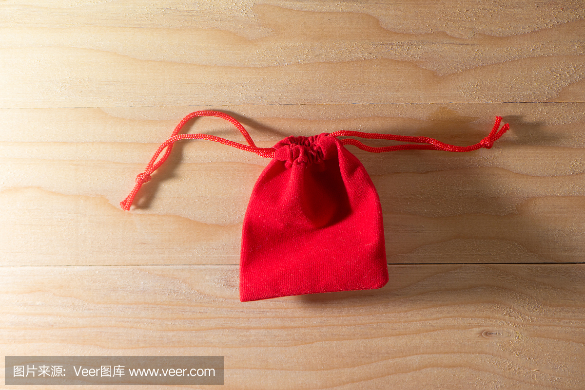 Red Gift Bag on Old Shabby Wooden Table co