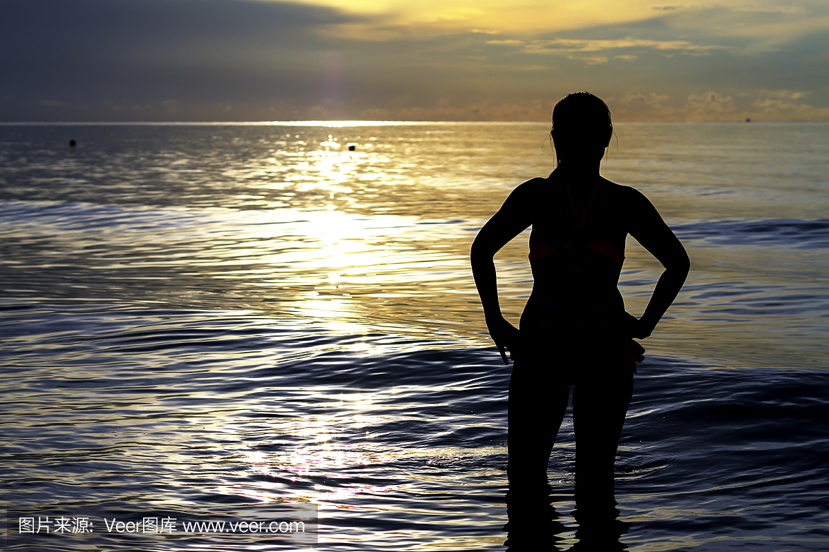 ith bikini sunrise silhouette on Thung Wua Lan Beach
