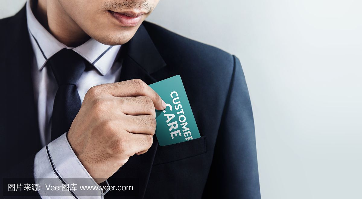 客户服务理念,商人将卡片'客户服务'放在口袋里