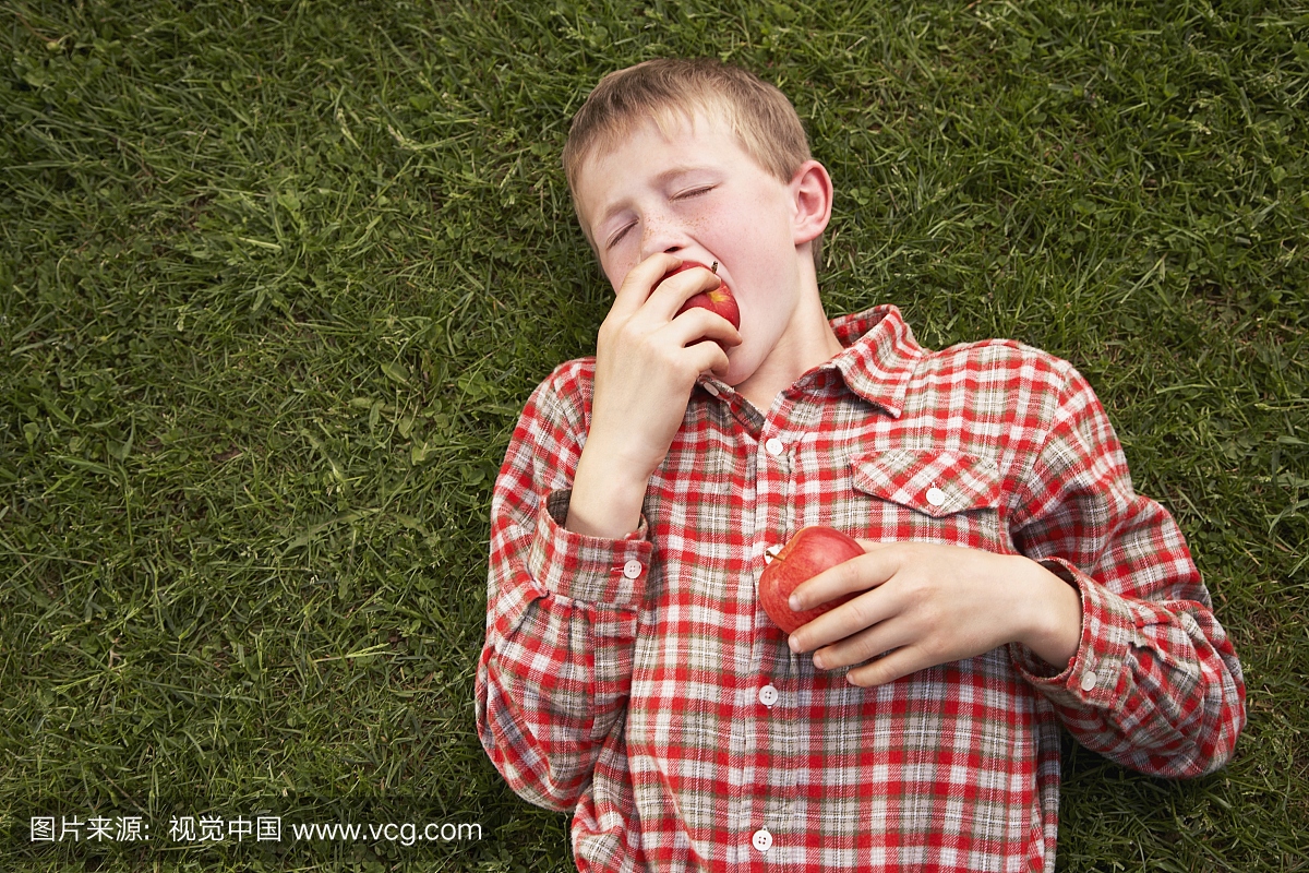 Boy Eating Apples