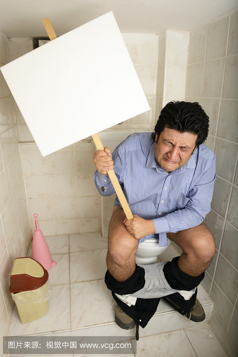 消化系统问题的厕所持有符号的人