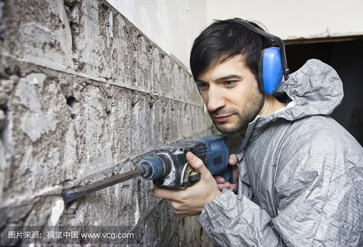 Man Using Power Chisel