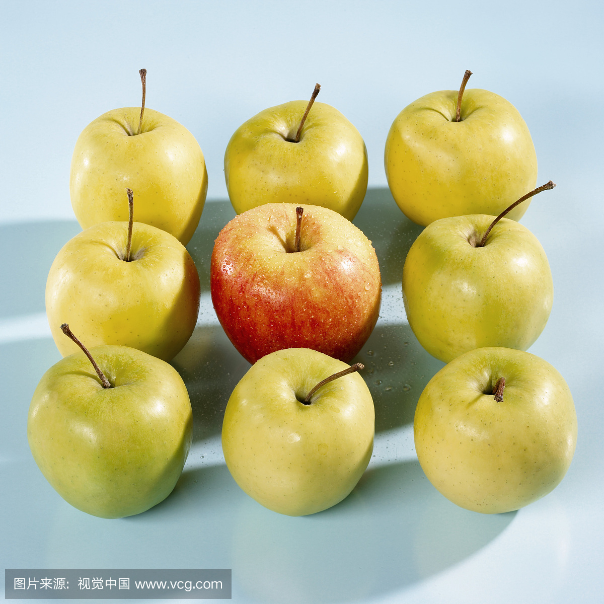 Nine Golden Delicious apples