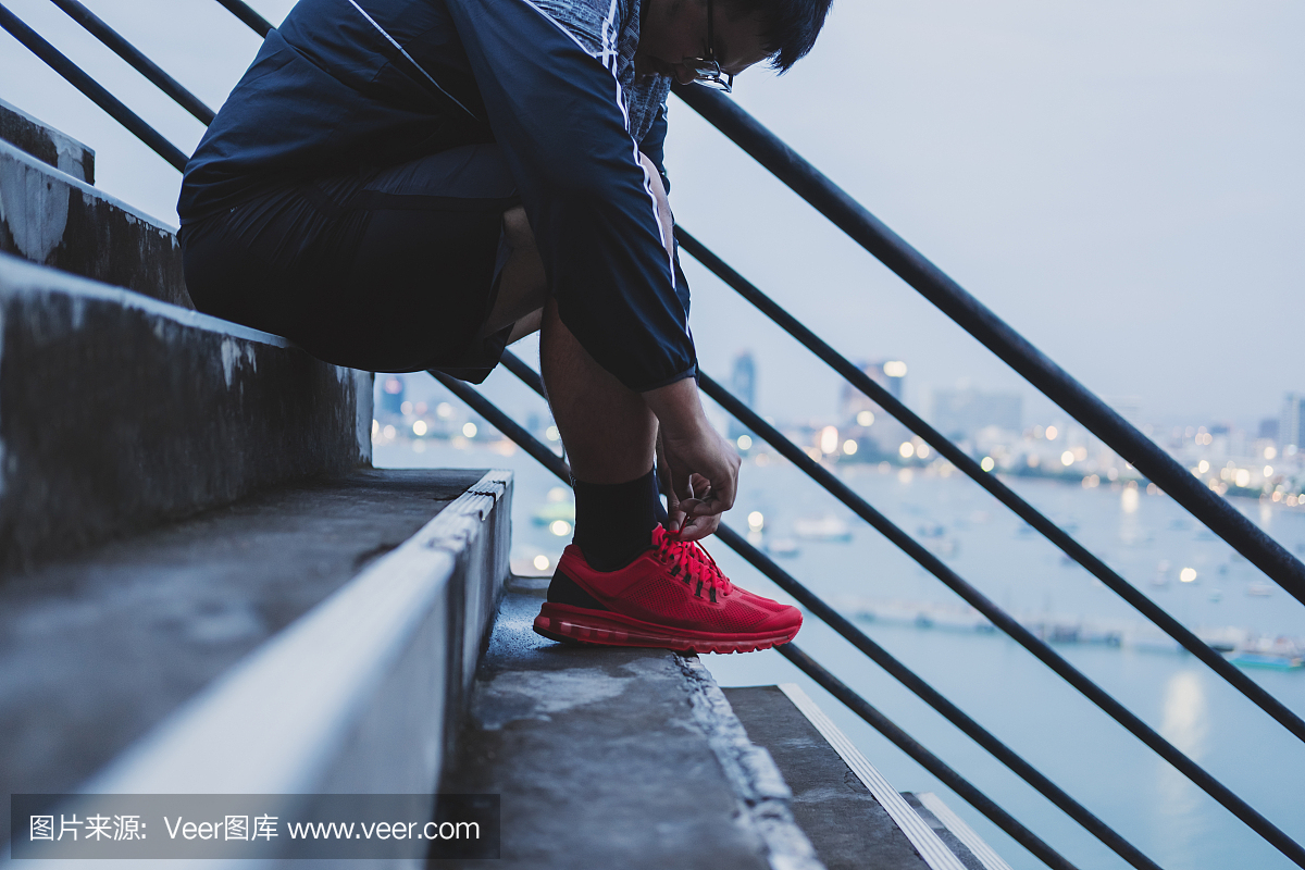 Asian Guy Tying Running Shoe, Preparing for R